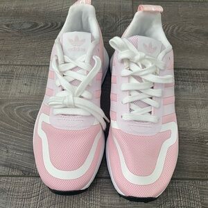 Brand new, not in box Adidas kids pink tennis shoes. Size 3.5